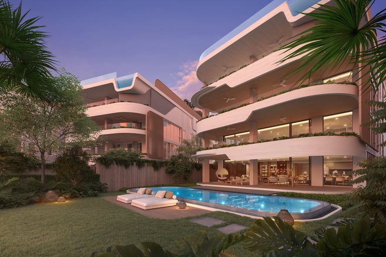 Modern curved residential building with illuminated balconies, swimming pool, tropical plants, and manicured lawn at dusk