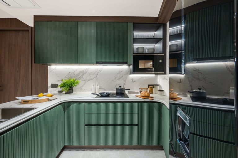 Modern kitchen with green ribbed cabinets, white marble backsplash, stainless steel appliances, and minimalist design