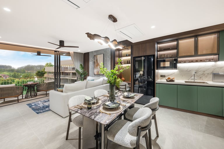 Modern open-concept living space with kitchen, dining area, and lounge featuring marble counters, green cabinetry, and panoramic windows overlooking mountains
