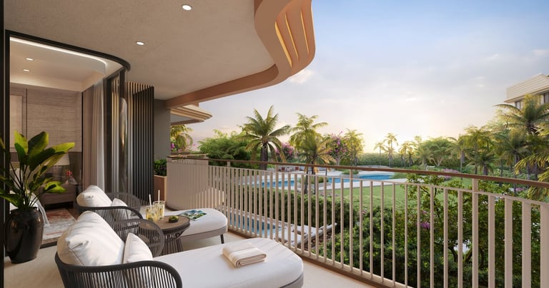 Modern luxury balcony with lounge chairs, white railing, and views of tropical landscape, palm trees, and swimming pool at sunset