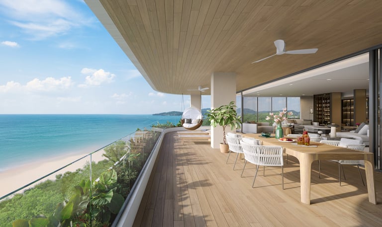 Modern beachfront penthouse terrace with ocean views, wooden deck, white furniture, and glass sliding doors opening to interior living space