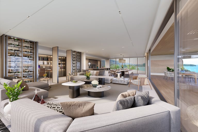 Modern luxury apartment interior with open-plan living area, neutral furnishings, floor-to-ceiling windows, and ocean view