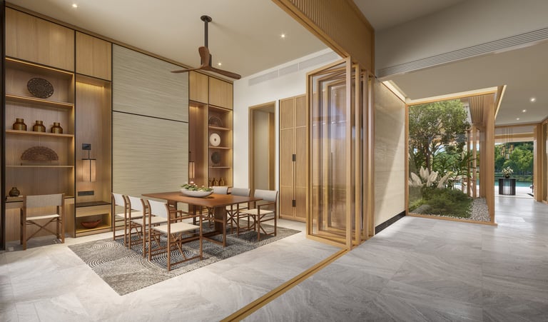Modern luxury dining room with wooden cabinetry, dining table, chairs, marble flooring, and glass doors opening to a garden
