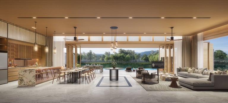 Modern open-plan living space with kitchen, dining area, and lounge overlooking a lake through floor-to-ceiling windows