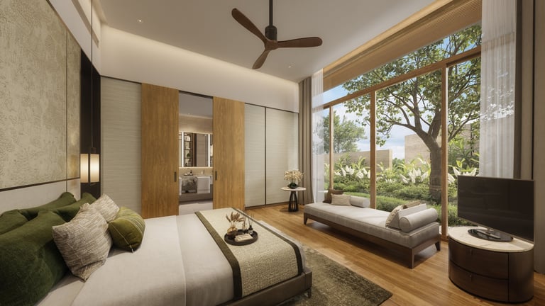 Modern bedroom with green accent pillows, wooden flooring, large windows overlooking trees, and contemporary furnishings